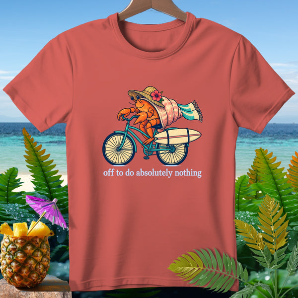 T-shirt with crab on bicycle carrying surfboard, text "off to do absolutely nothing".