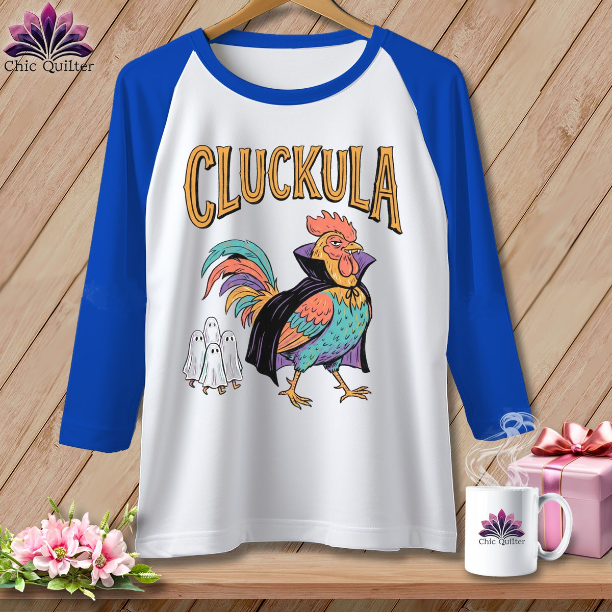 Raglan t-shirt with a cartoon rooster dressed as Dracula and three ghosts.