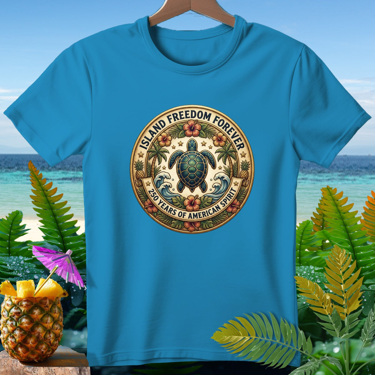 Blue t-shirt featuring a circular emblem with a sea turtle, palm trees, flowers, and text.