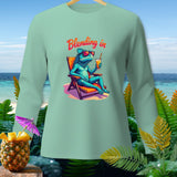 Mint green long-sleeve shirt with a blue iguana on a lounge chair and 