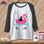 Black cat wearing witch hat on pink flamingo float with moon and stars.