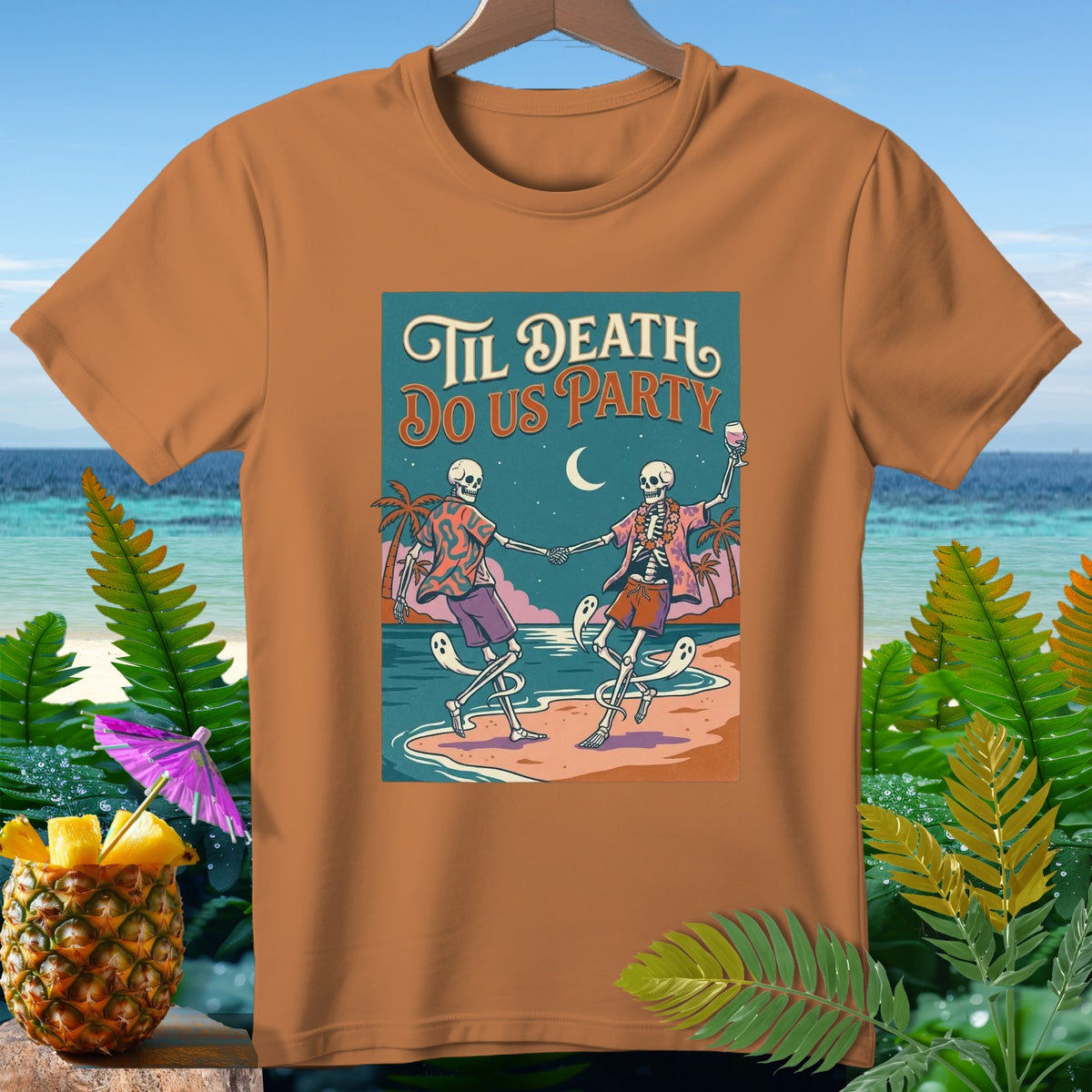 T-shirt with "Til Death Do Us Party" text and dancing skeletons on a beach.