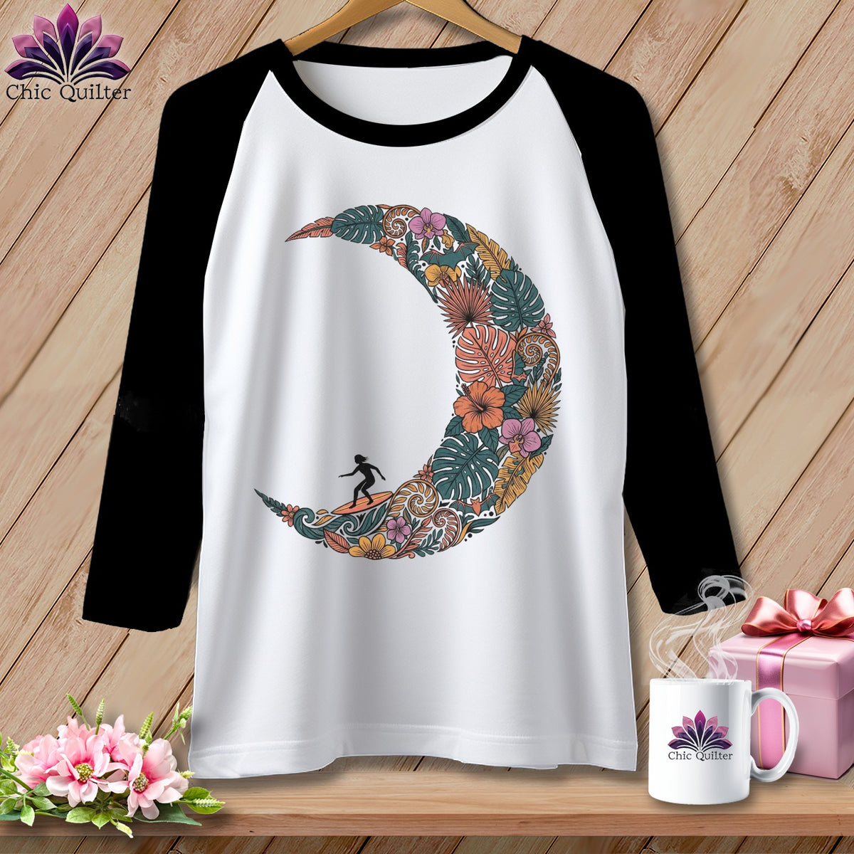 Baseball tee with floral crescent moon and surfer graphic, "Chic Quilter" logo.
