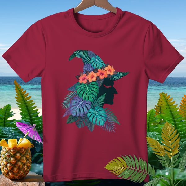 Maroon t-shirt featuring a witch's hat adorned with tropical leaves and flowers.