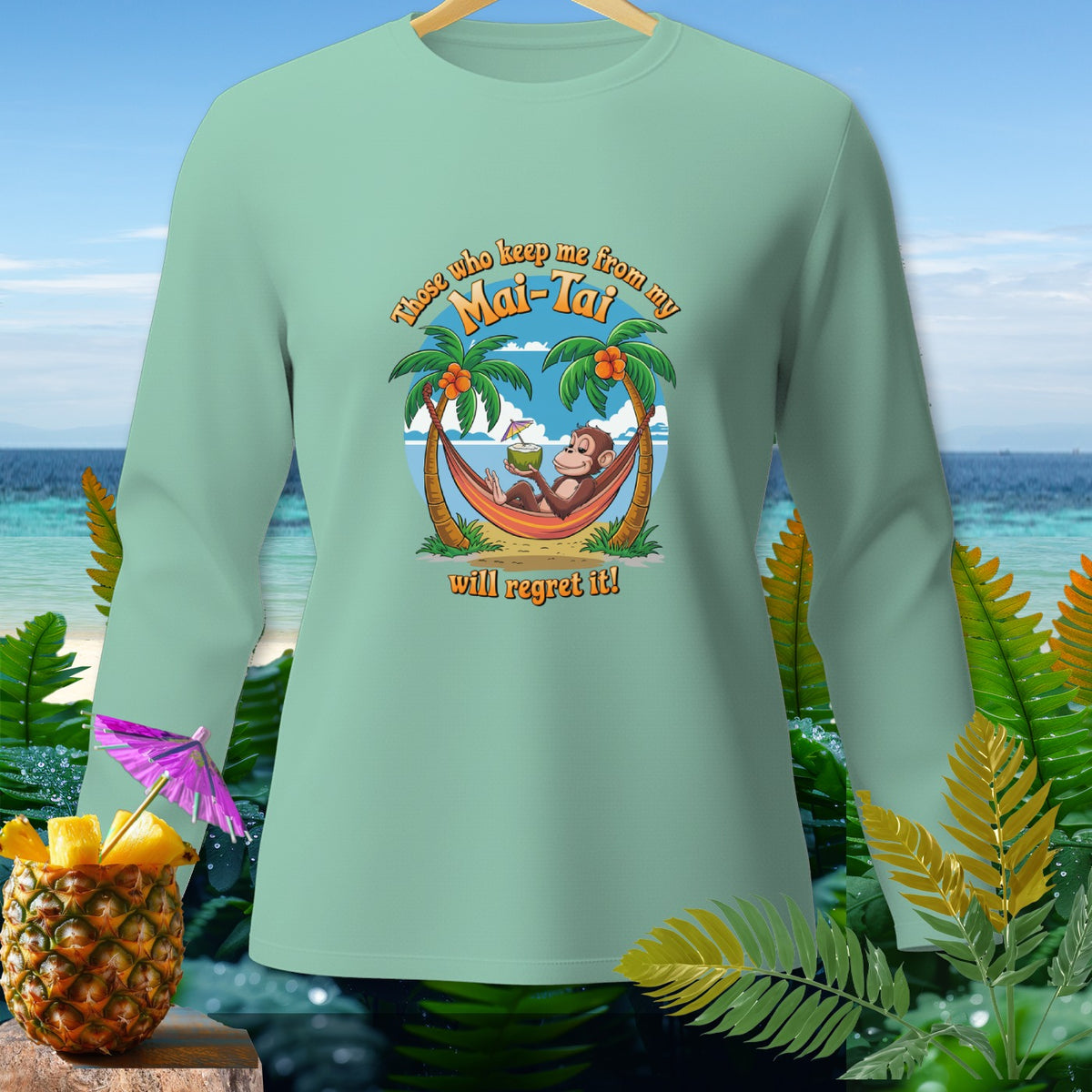 Mint green long sleeve shirt with monkey in hammock text "Those who keep me from my Mai-Tai will regret it!"