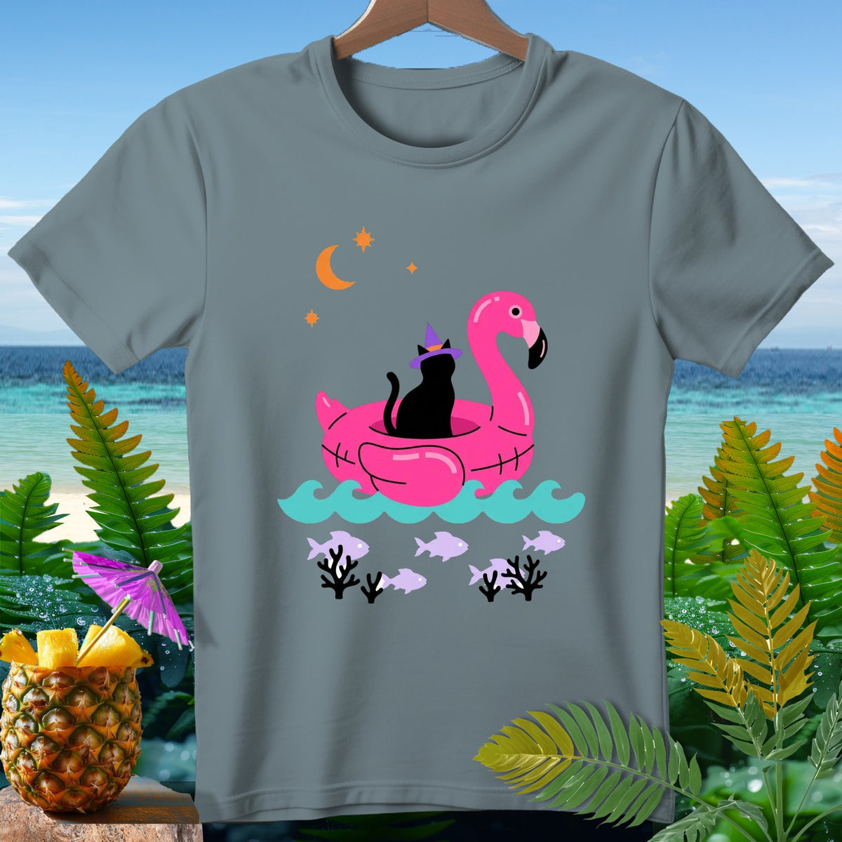 Black cat wearing witch hat on pink flamingo float in water with fish.